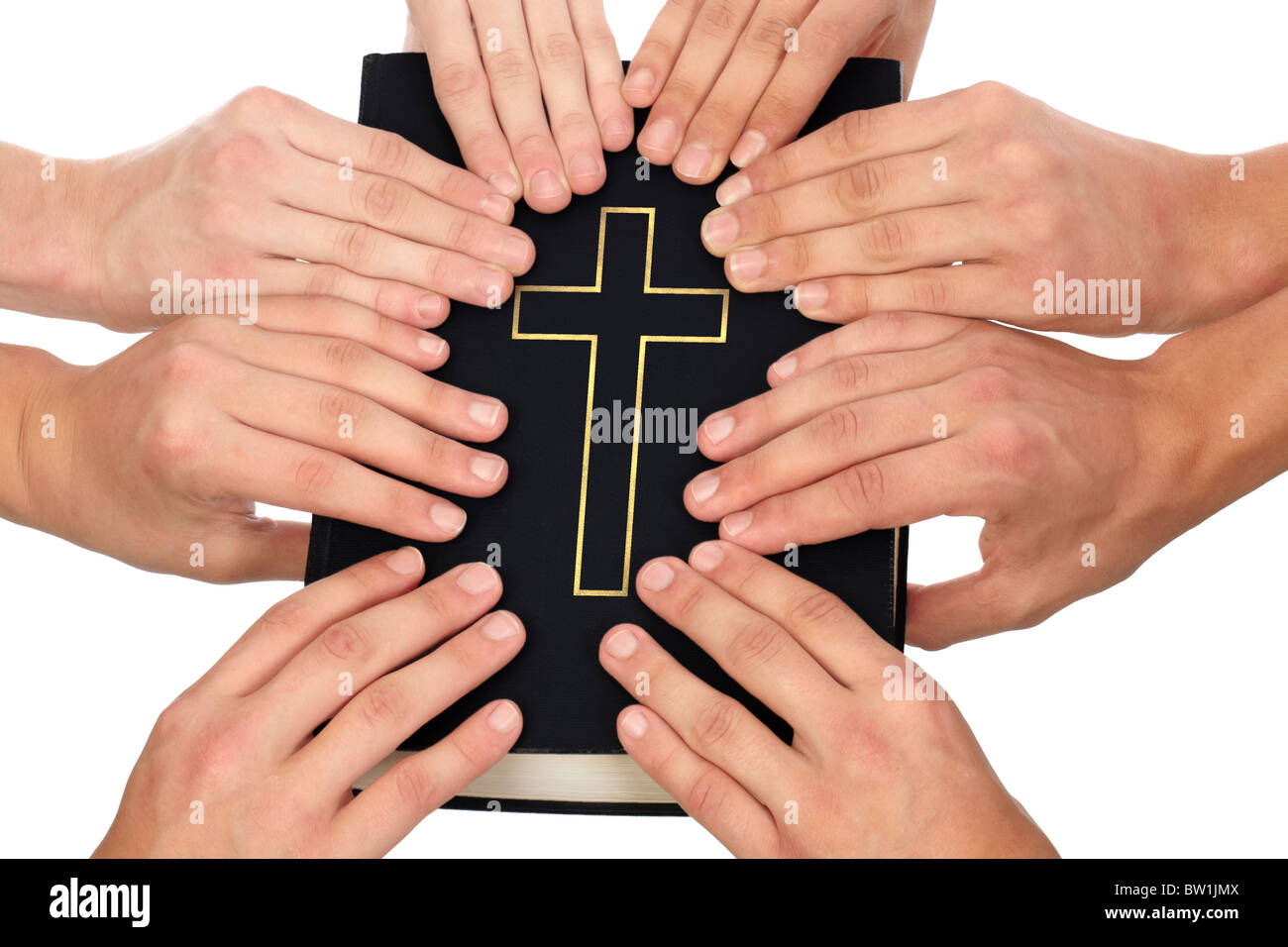 Group of people holding Holy Bible to unity and prayer Stock Photo