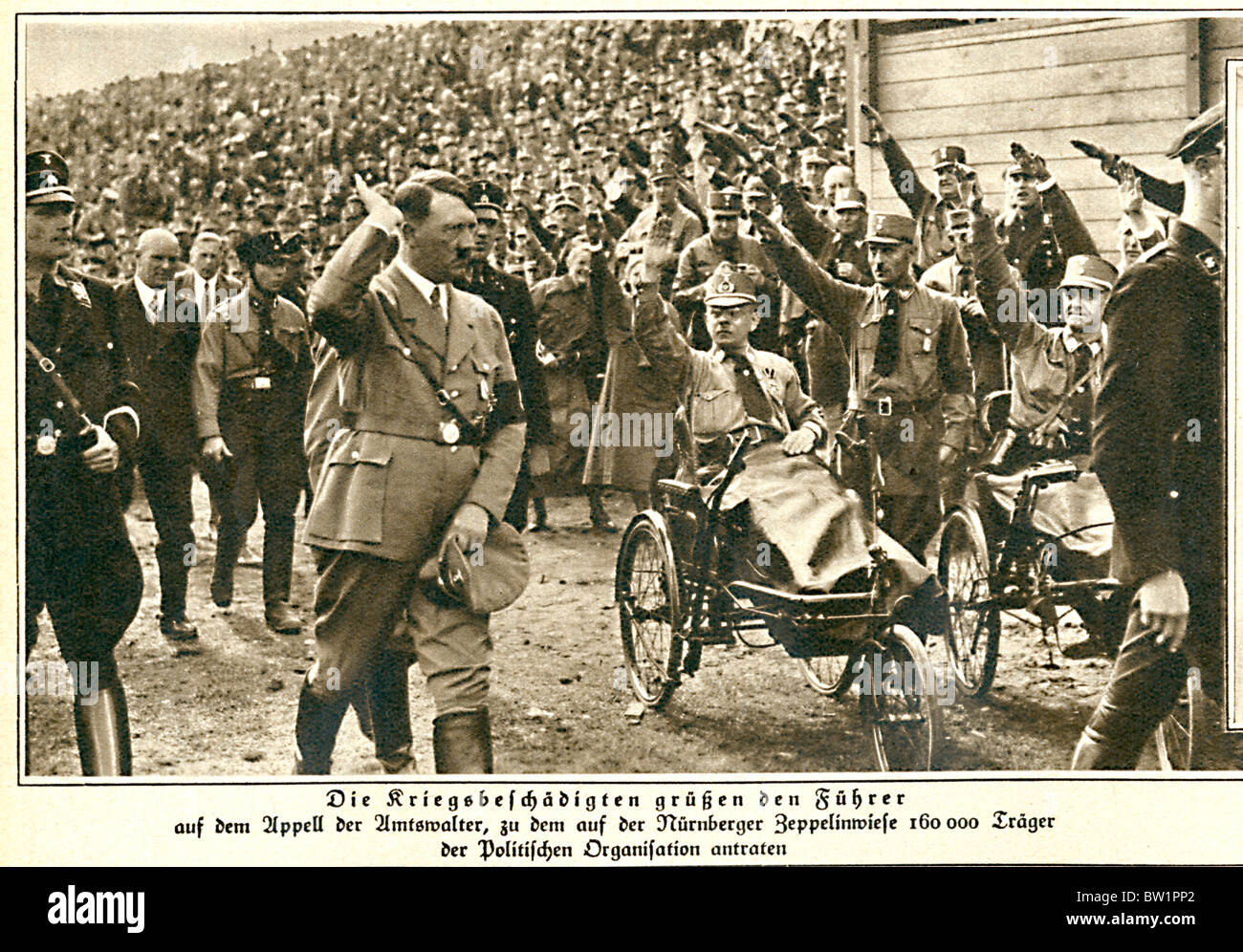 Hitler, Nuremberg, 1933 photo of the Fuhrer saluted by war veterans at a rally in the Bavarian City Stock Photo