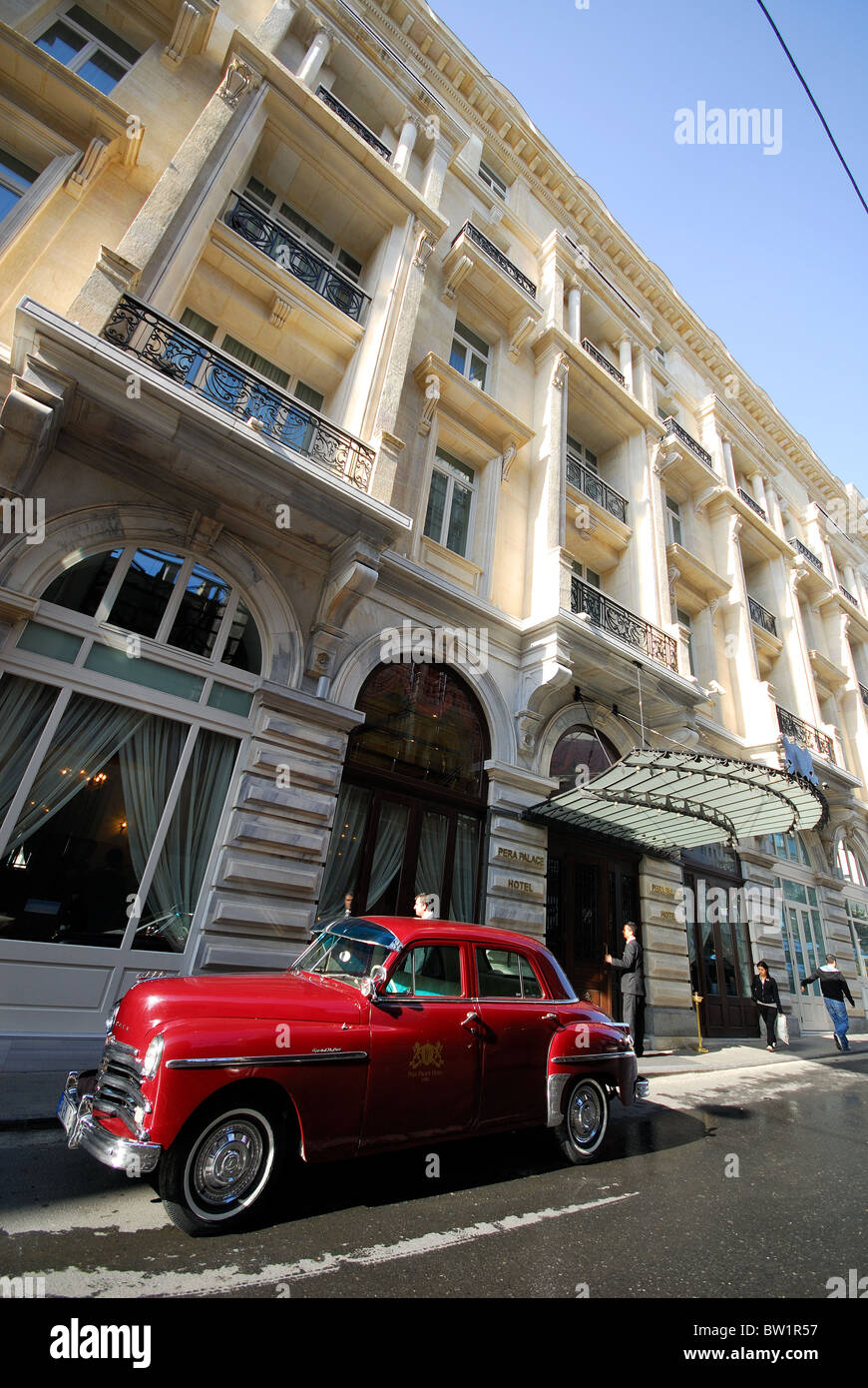 ISTANBUL, TURKEY. The renovated Pera Palas Hotel in Beyoglu, with the hotel's classic Plymouth parked outside. 2010. Stock Photo