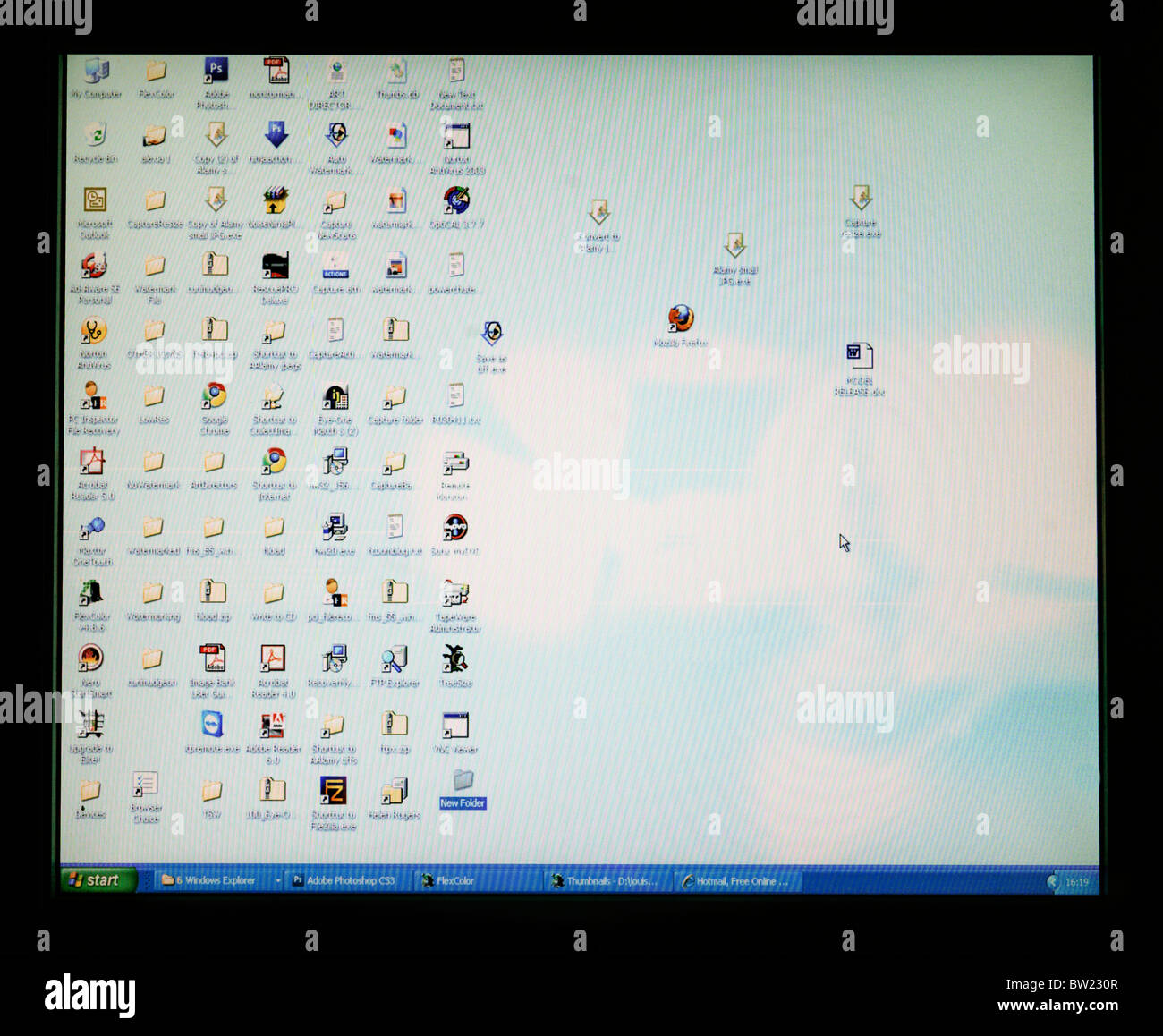 Computer Screen With Lots Of Software Icons On Desktop Stock Photo