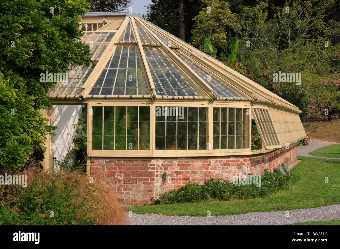 wood and brick greenhouse in gardens at Greenway house former home of