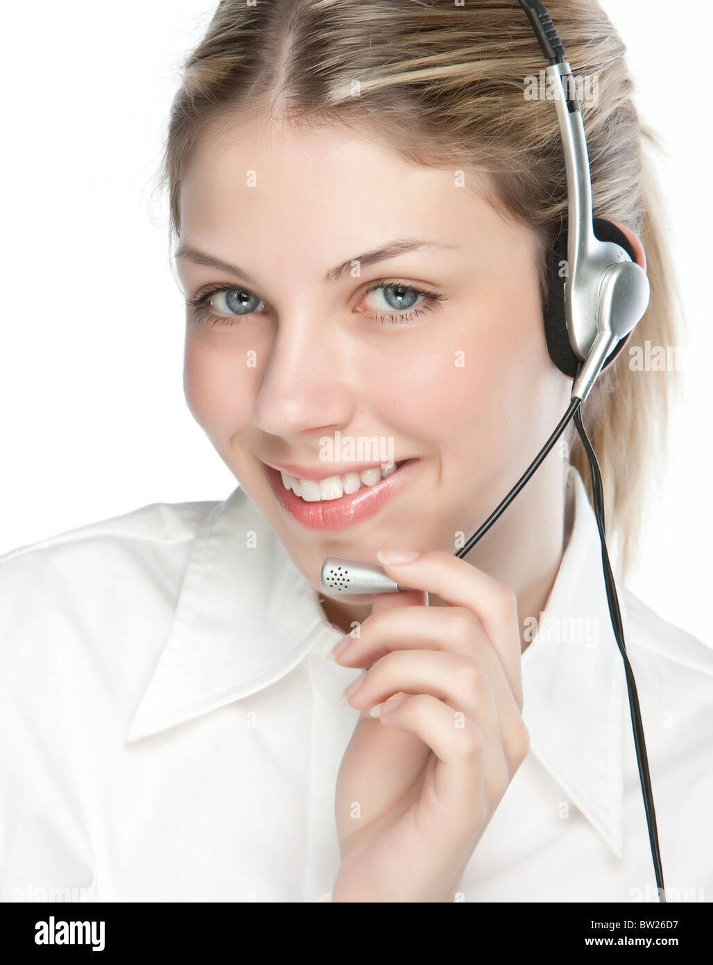 A friendly secretary/telephone operator in an office environment Stock