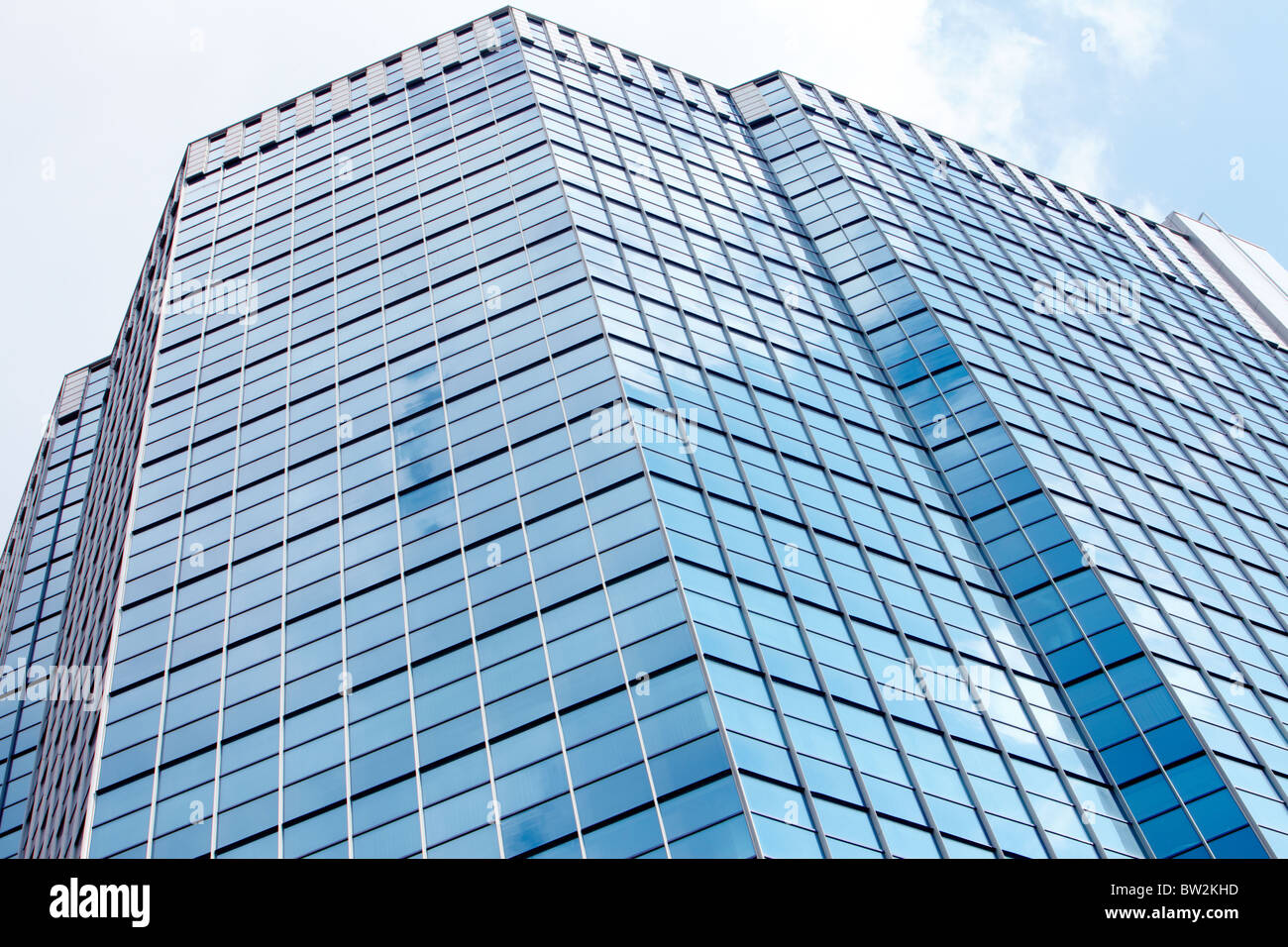 Image of modern office building against cloudy sky Stock Photo - Alamy