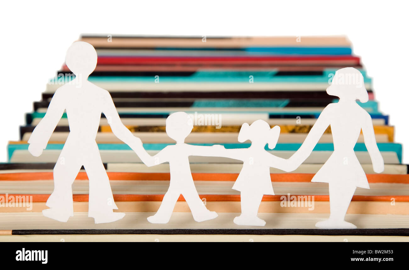 Family figures made from paper with books background, school theme Stock Photo