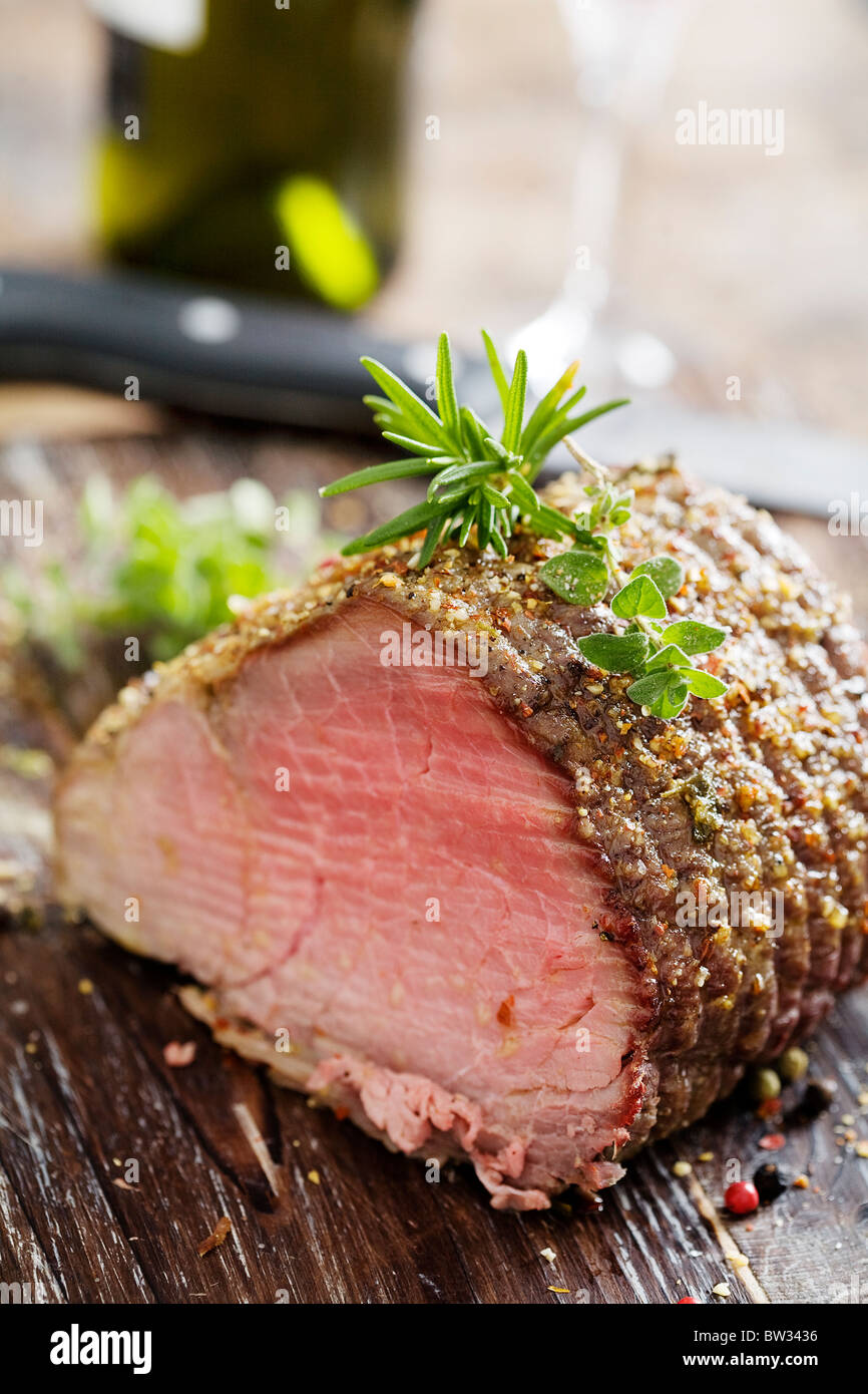 nice piece of roasted sirloin beef covered in herbs Stock Photo