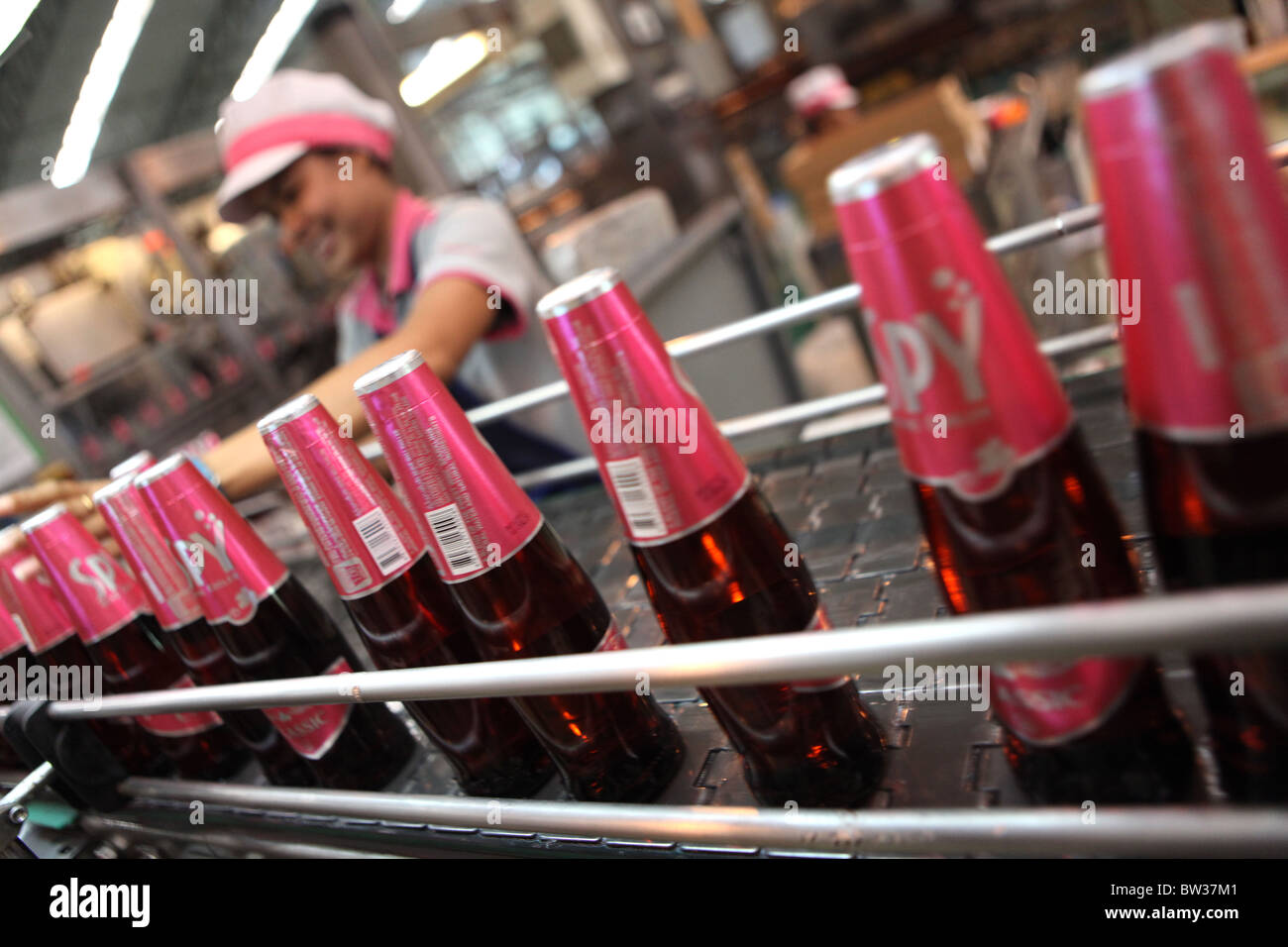 A worker on the production line of Spy Wine Cooler at the Siam Winery