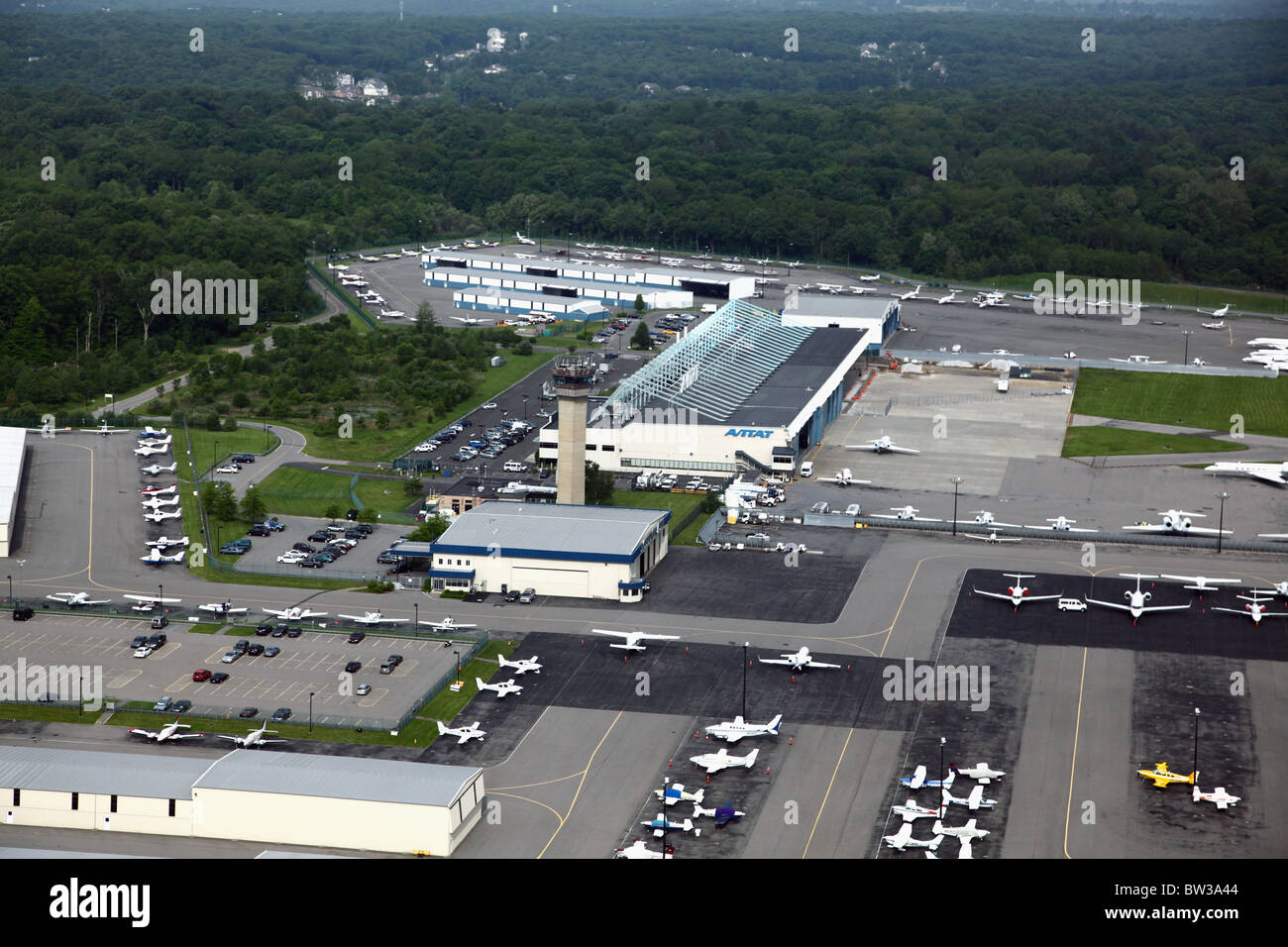 Aerial view of hangars, tarmac and control tower at Westchester County Airport, Harrison, NY, USA Stock Photo