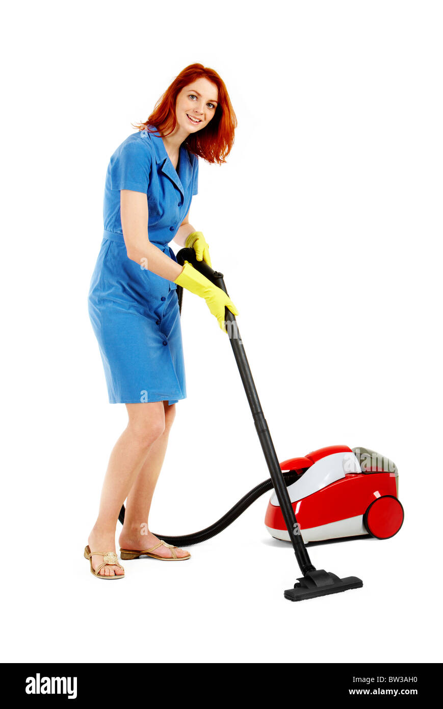 Portrait of nice housewife doing housework with vacuum cleaner Stock Photo