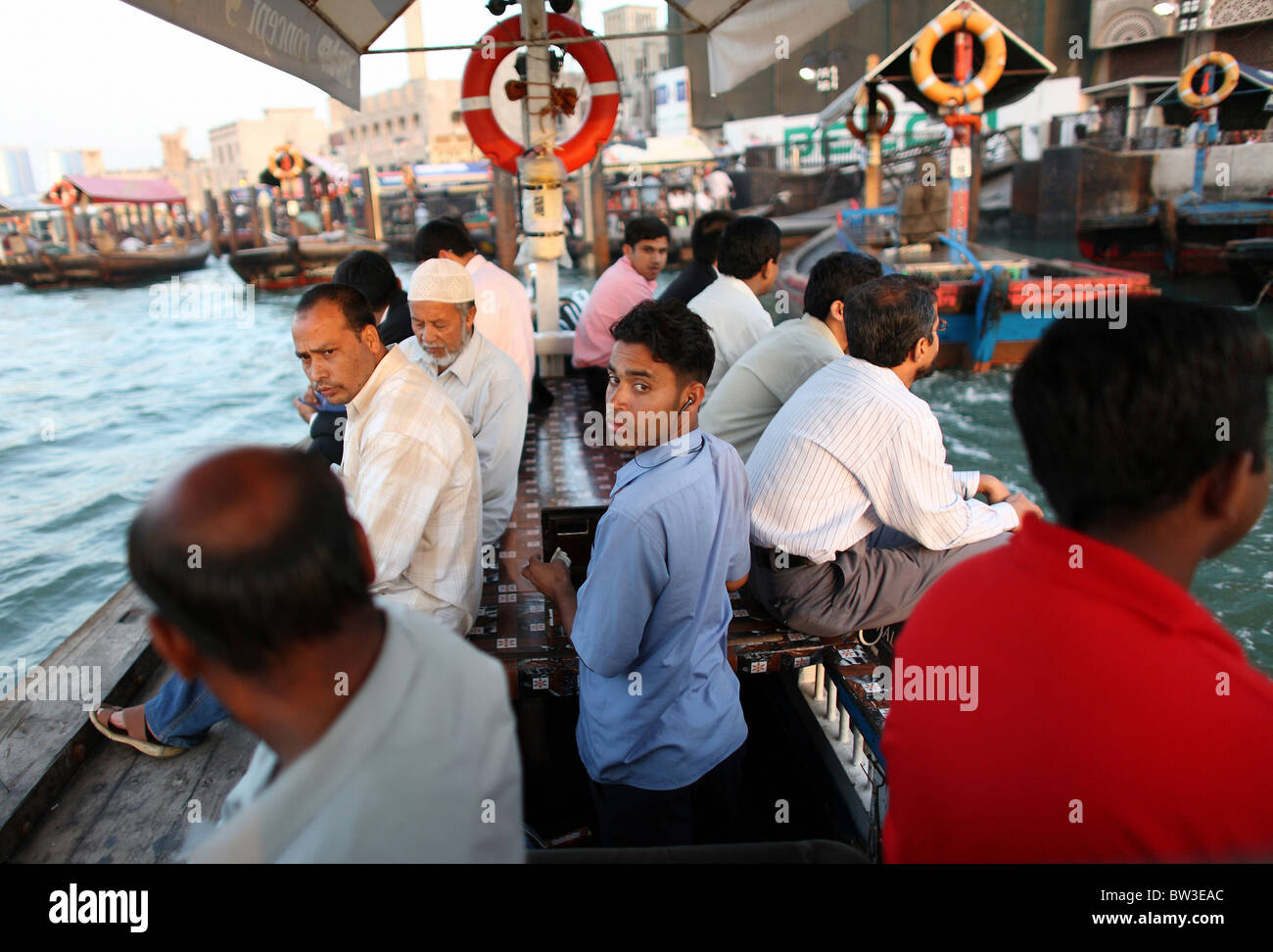 Locals in a dhow on the Dubai Creek, Dubai, United Arab Emirates Stock Photo