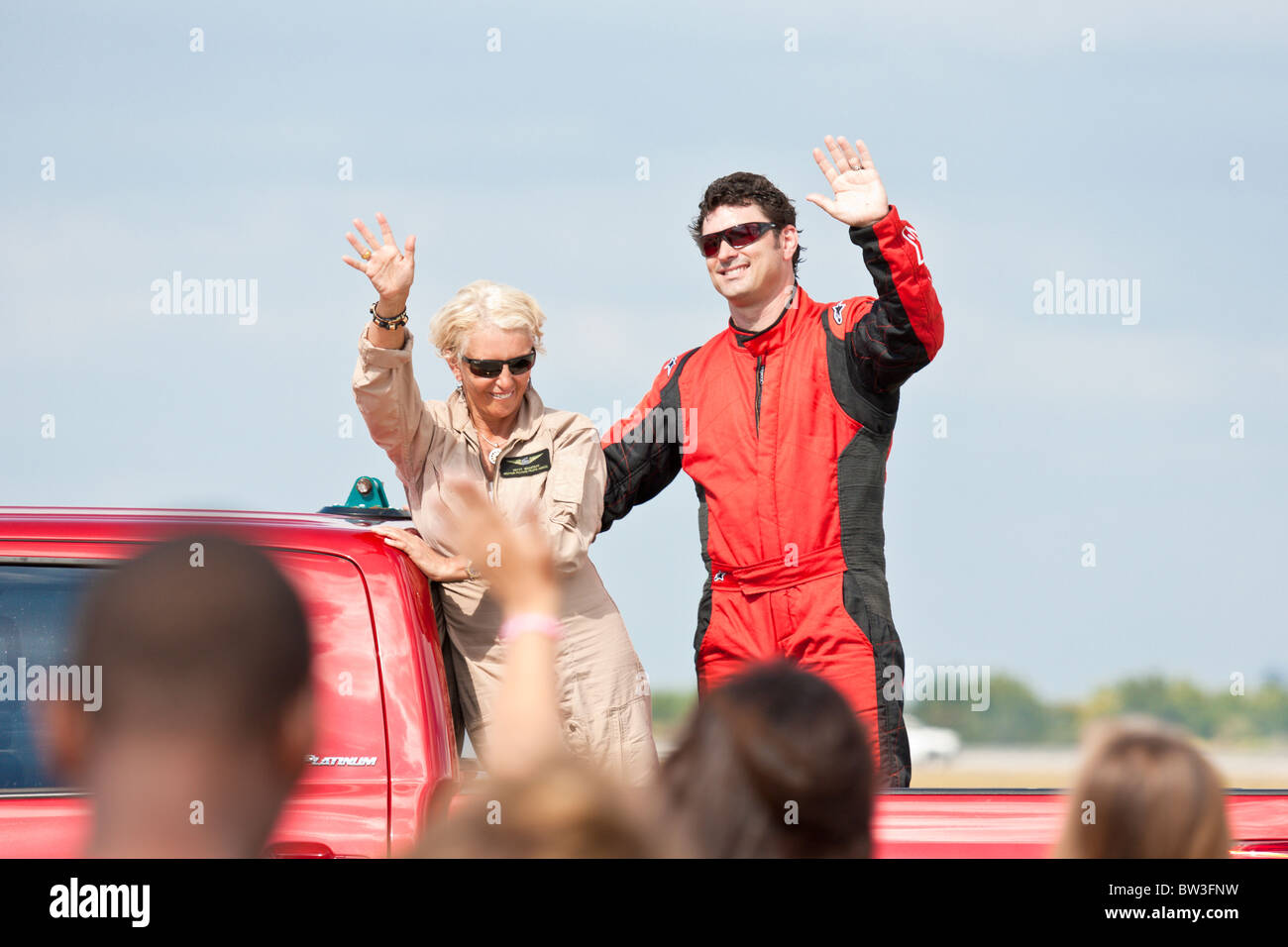 Pilots Patty Wagstaff and Skip Stewart wave to the crowd after performing in air show at NAS Jacksonville, Florida Stock Photo