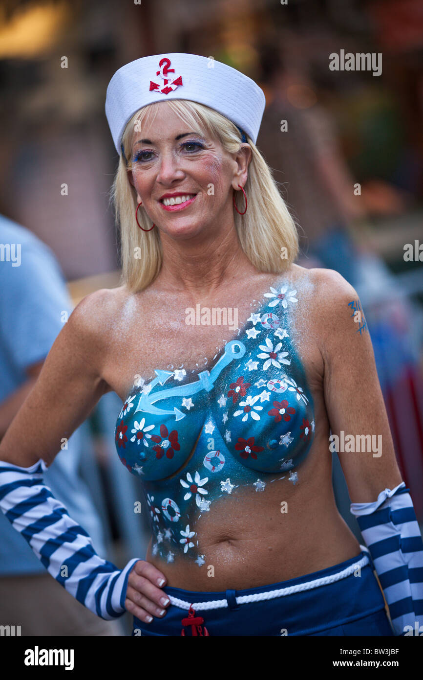 A topless reveler in only body paint during Fantasy Fest halloween parade i...