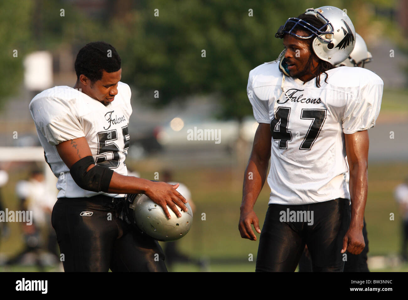 Fredericksburg Falcons football players converse during warmups prior to a  minor league football game against the Virginia Kings Stock Photo - Alamy