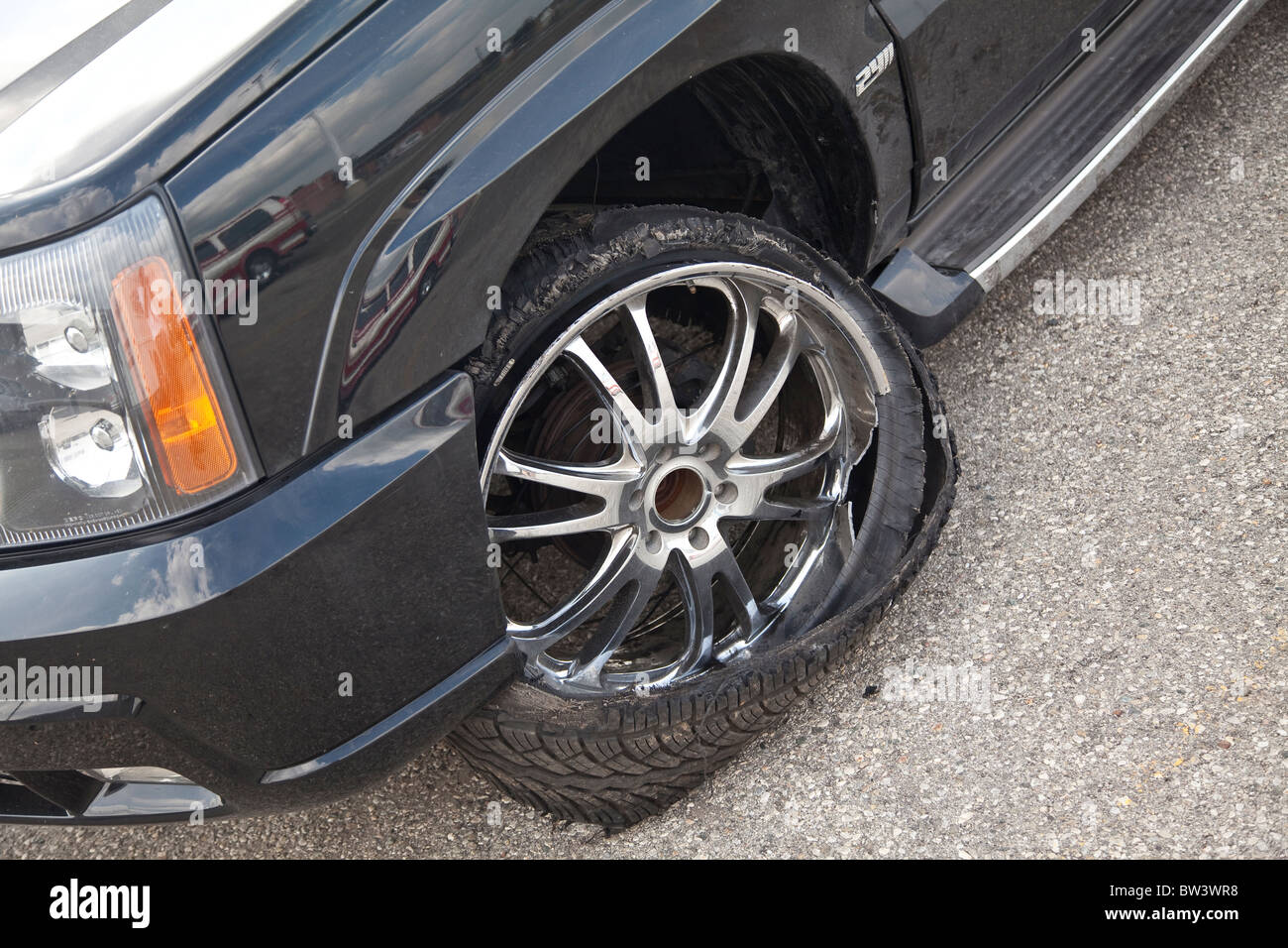 Damage to tire of car Stock Photo Alamy