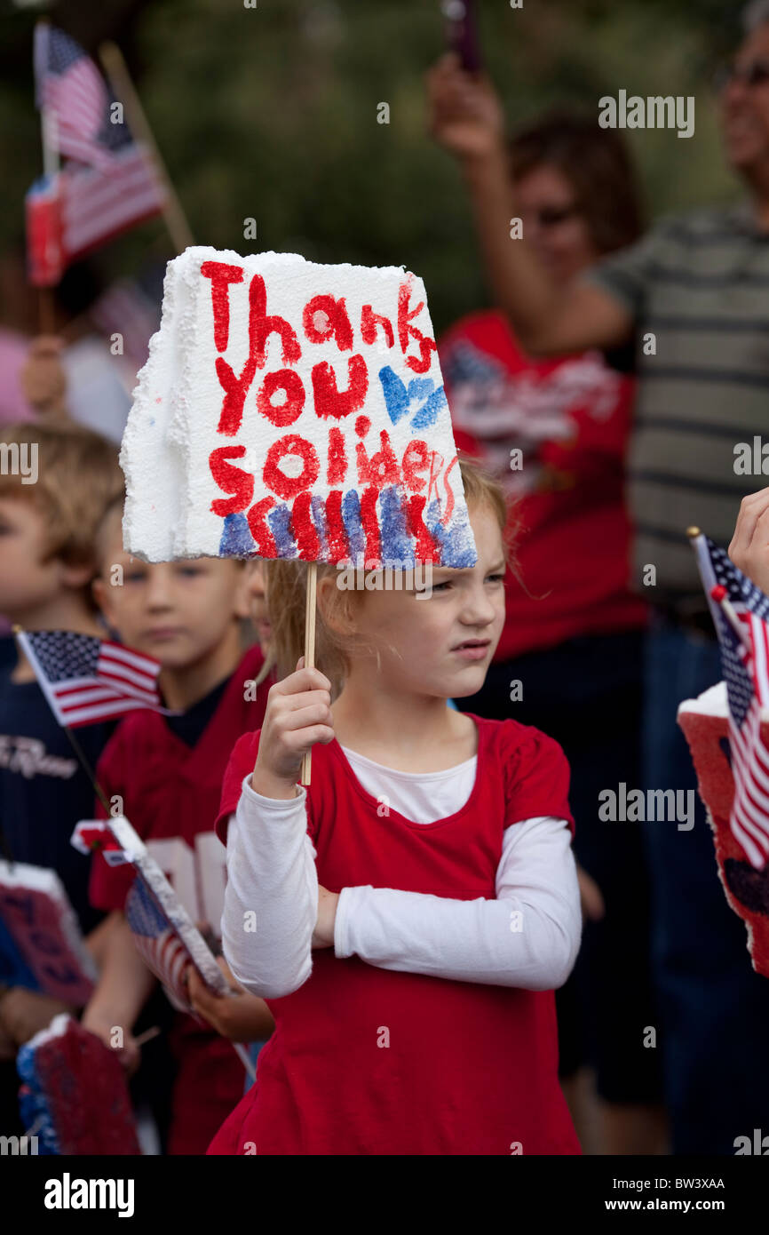 Elementary school children from Texas School for the Deaf show patriotism at the annual Veteran's Day parade Stock Photo