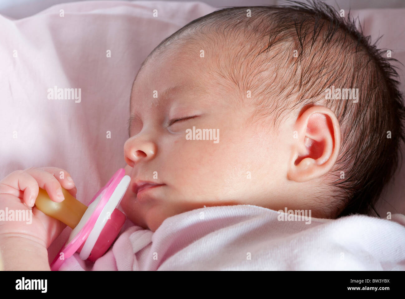 Newborn Baby Girl Sleeping in her Crib Stock Photo Alamy