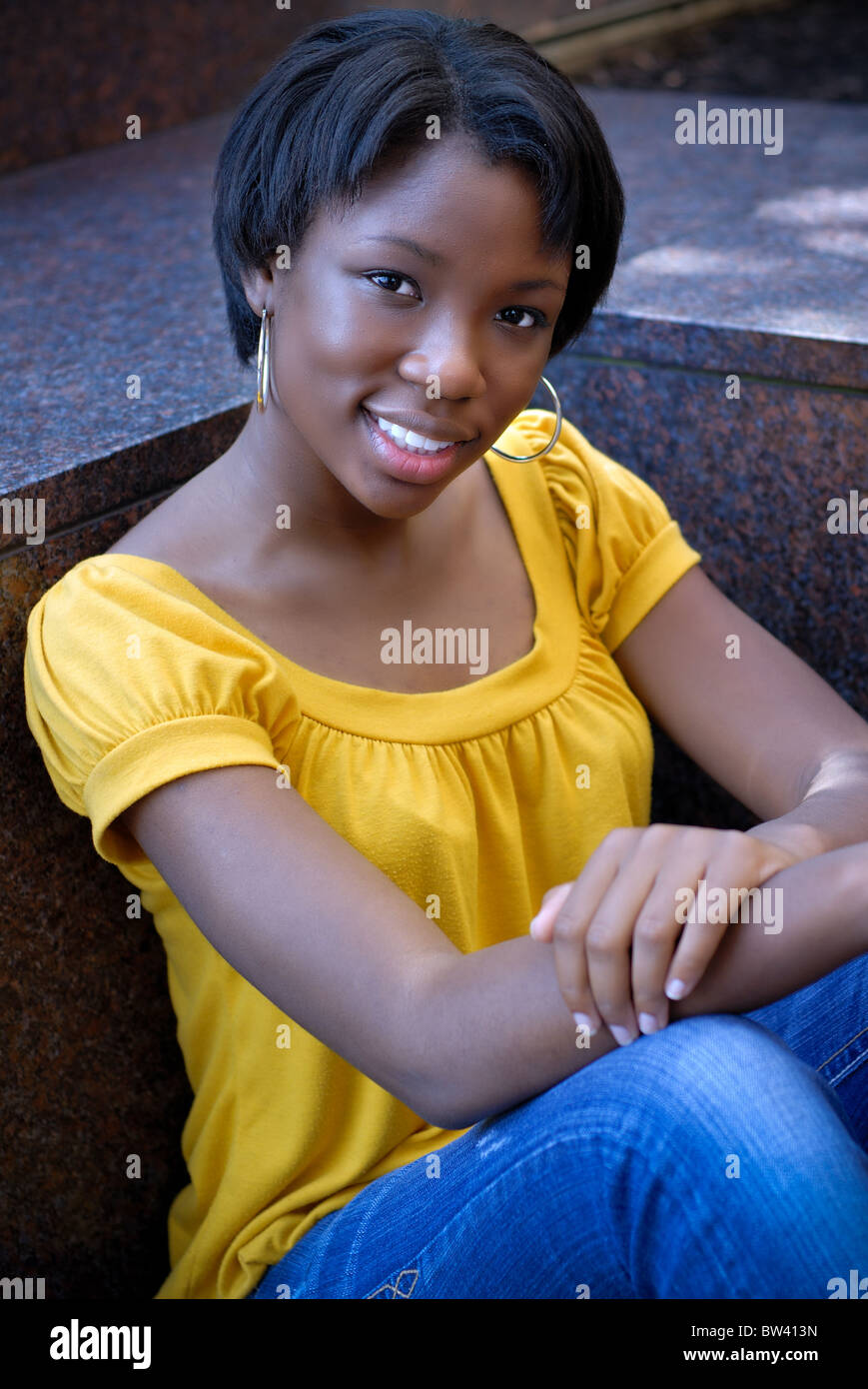 Portrait of a black African American young woman, a high school student ...