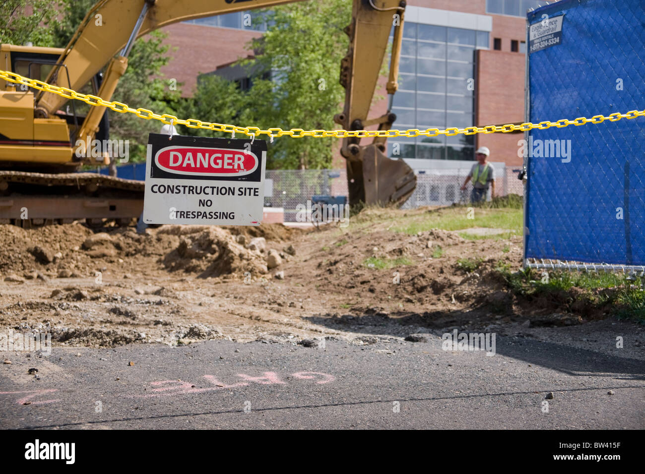 Danger sign in front of a construction site Stock Photo - Alamy