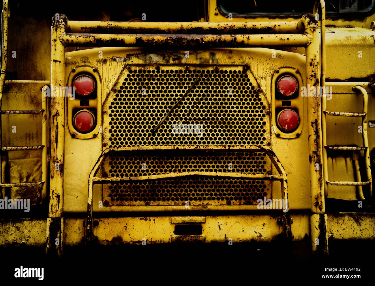 Rusty Big Rig Front The front of a large dump truck is rather ominous. Big mining dump ...