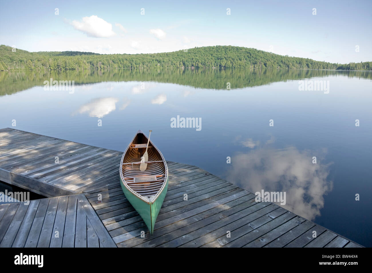 Green canoe on cottage dock, Algonquin Park, Ontario Stock Photo Alamy