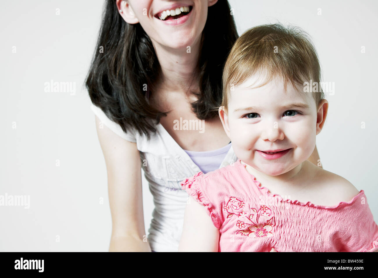 Portrait of mother and one yearold daughter smiling, Otterburn Park
