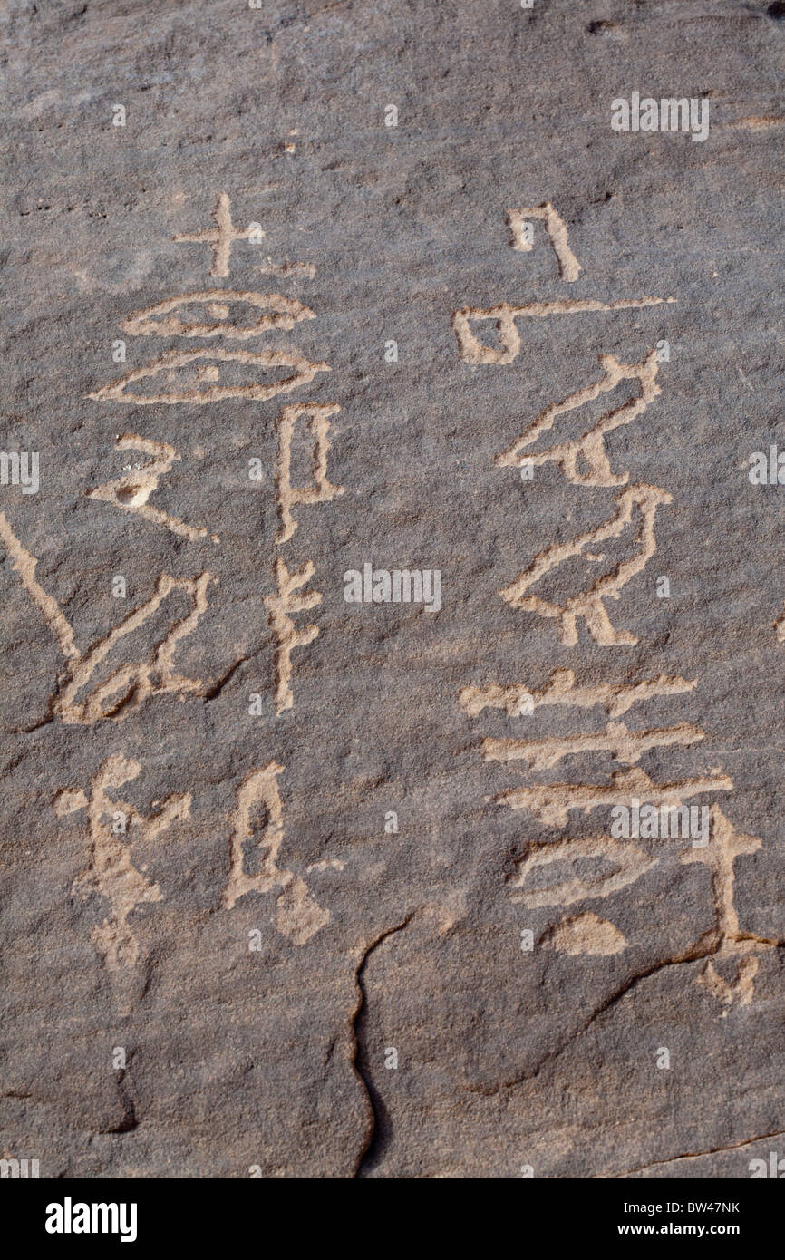 Carved hieroglyphs etched on cliff wall in Wadi Barramiya in the Eastern Desert of Egypt Stock Photo