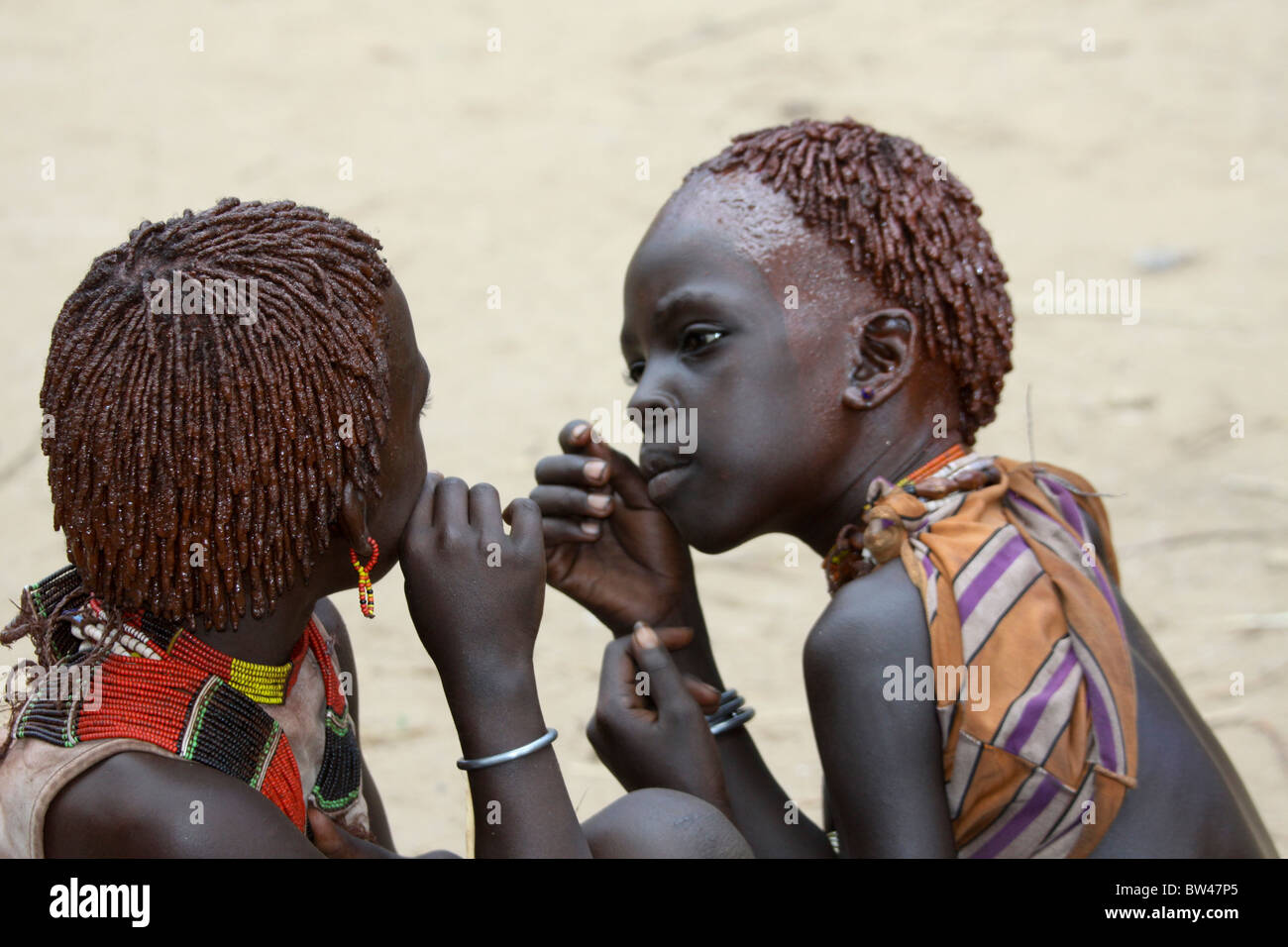 Africa, Ethiopia, Omo River Valley Hamer Tribe two young girls with ochre hair The hair is coated with ochre mud and animal fat Stock Photo