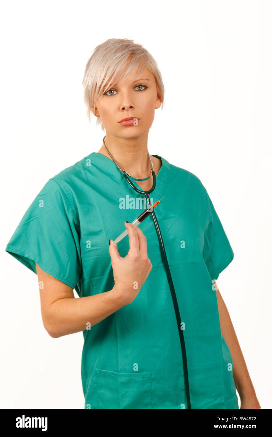 young medic holding a syringe full of blood Stock Photo