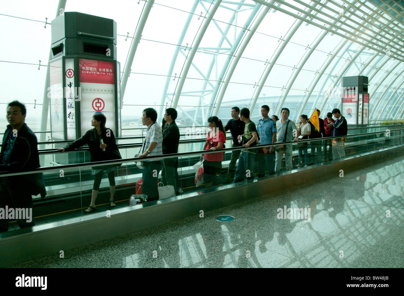 CHINA .Passengers at the new terminal of the international airport of Guangzhou,host of the Asian Games 2010 Guangdong province Stock Photo