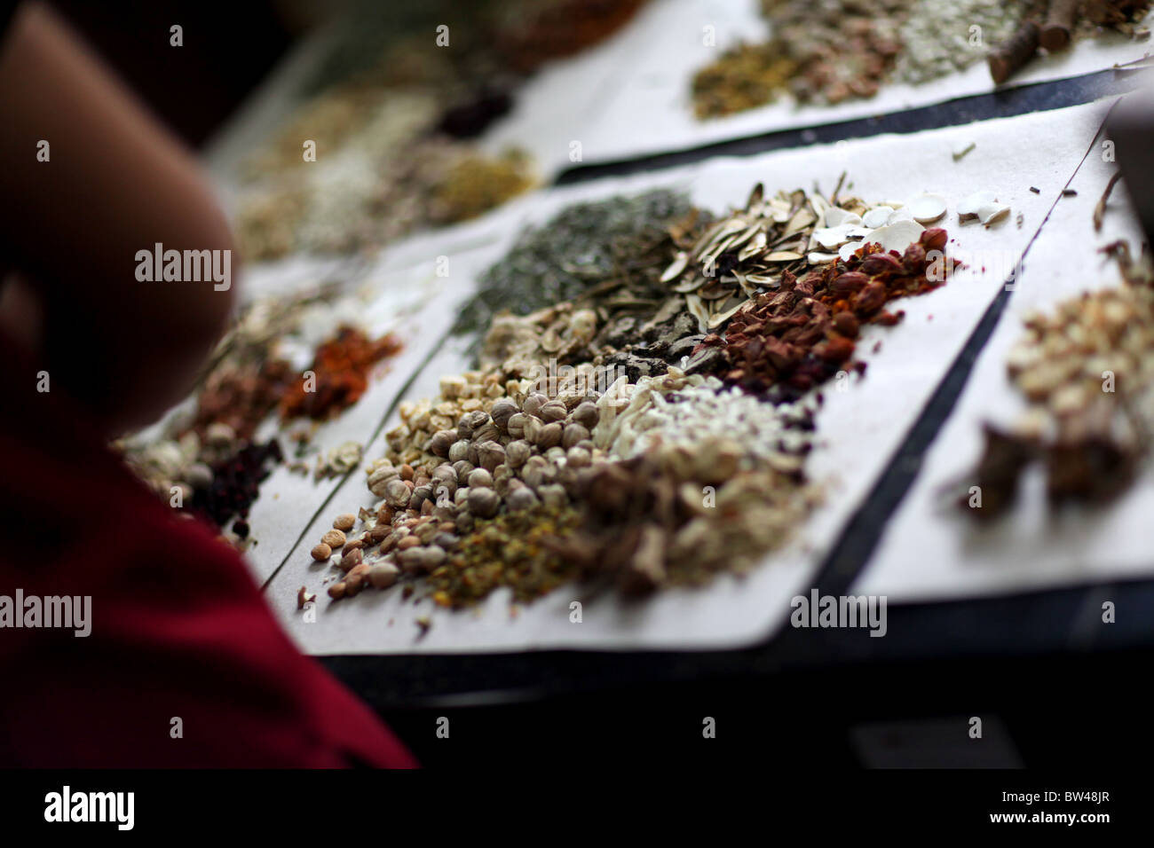 Personal presciptions being prepared at the Fulintang Traditional Chinese Herbal Medicine Store in Kunming, China. Stock Photo