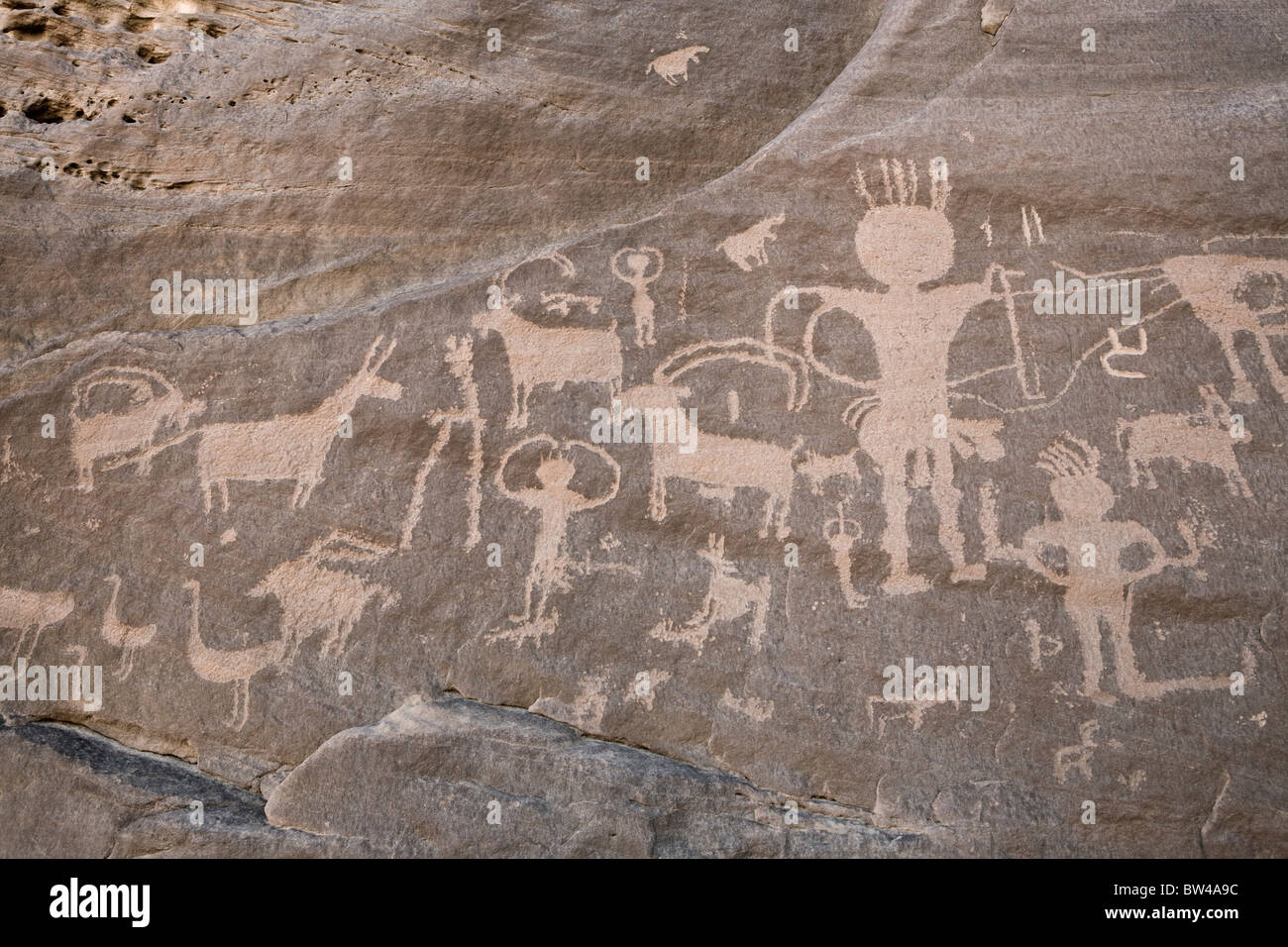 Petroglyphs of men and animals on rock-face in Wadi Umm Salam in Eastern Desert of Egypt Stock Photo