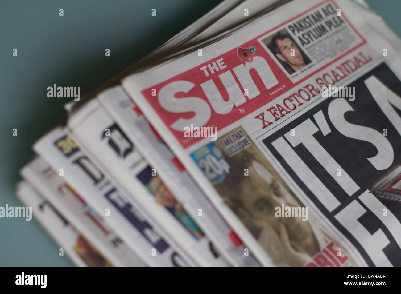 Daily UK tabloid newspaper, the sun, with other popular uk tabloids Stock Photo