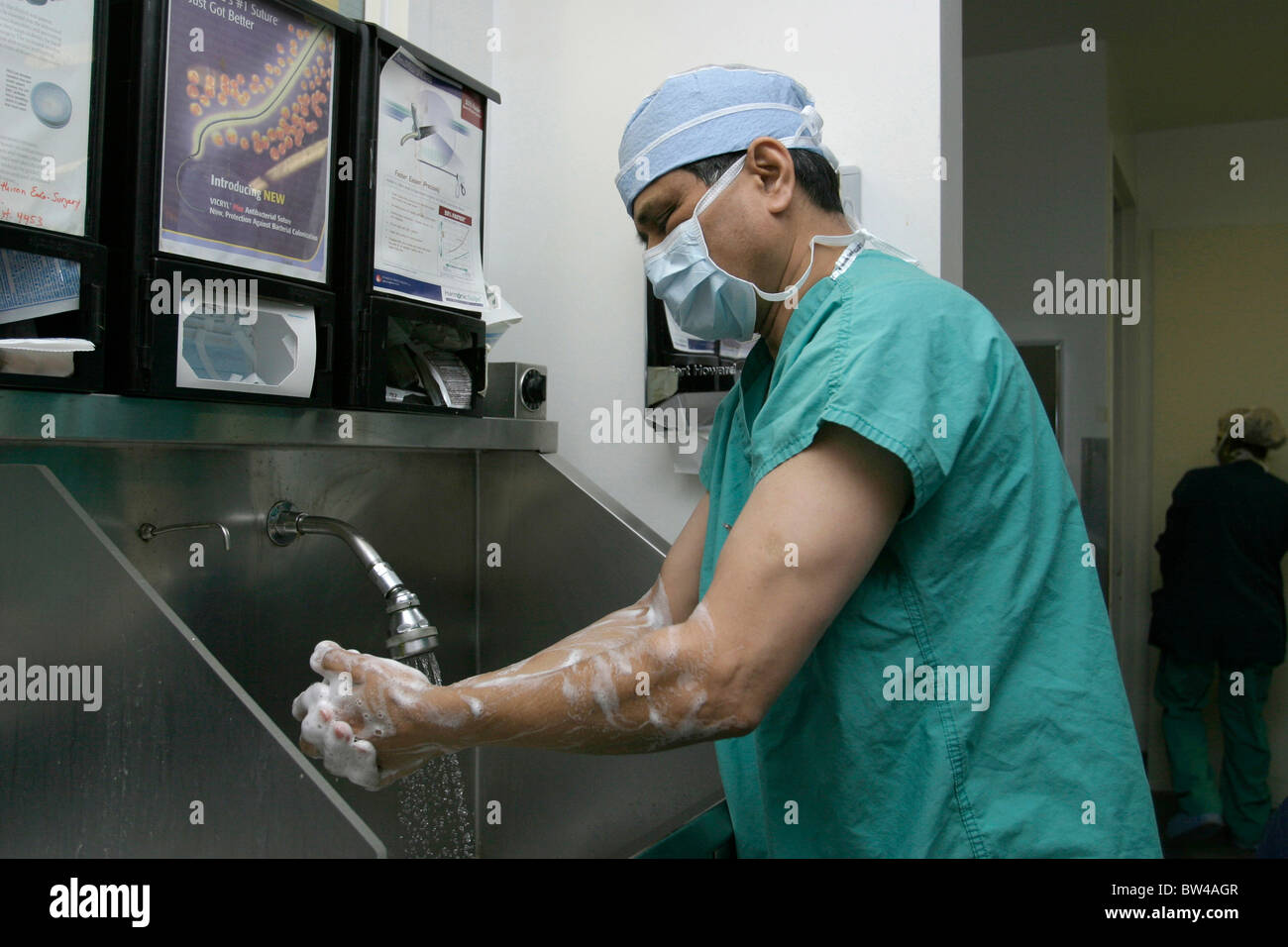 Surgeon scrubs up in the OR area before performing surgery Stock Photo Alamy