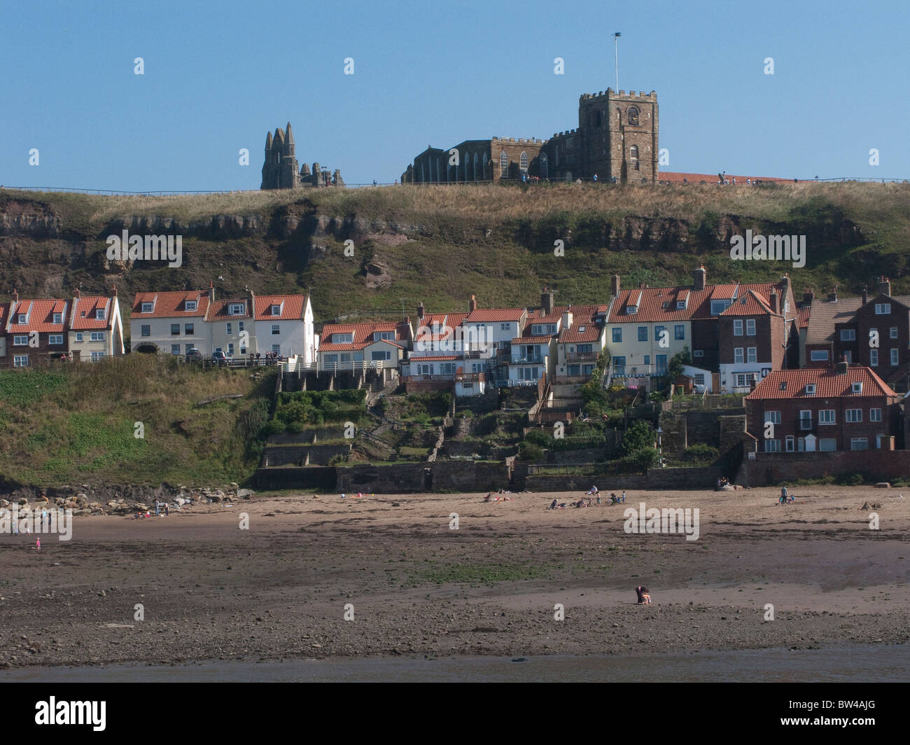 Whitby Abbey overlooking a row of houses in Whitby, North Yorkshire