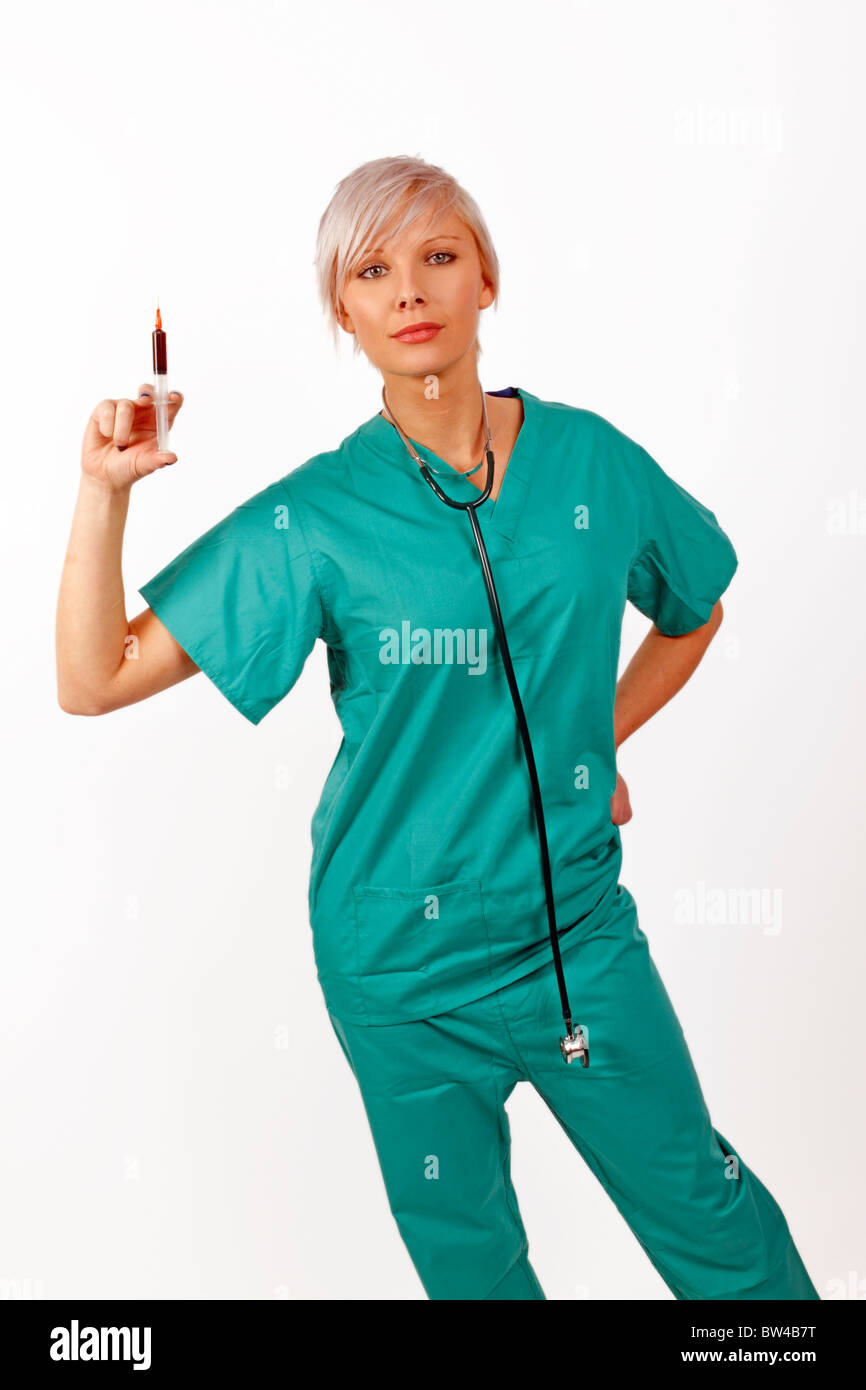 young medic holding a syringe full of blood Stock Photo