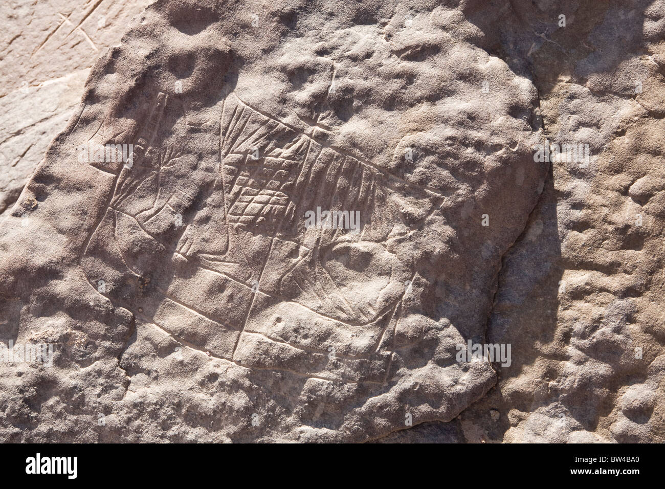 Petroglyph of boat with large sail in Wadi Mineh, in the Eastern Desert of Egypt Stock Photo