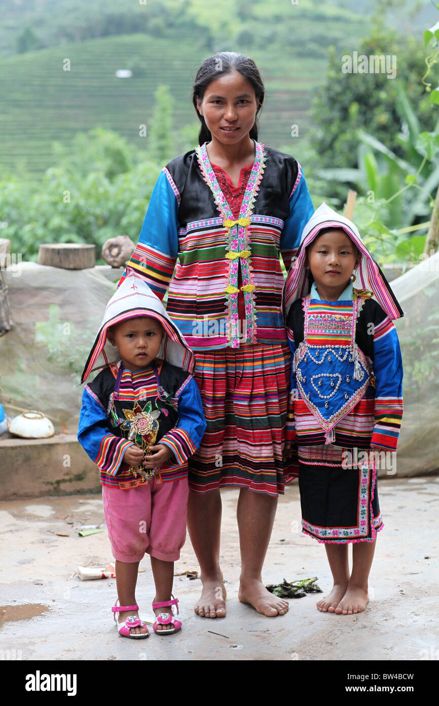 A family dressed in traditional Dai clothing near the town of ...