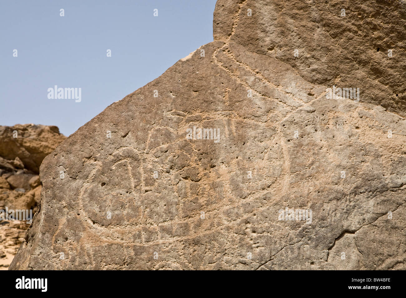 Petroglyph of boat and animals on a rock-face  in the Eastern Desert, Egypt Stock Photo