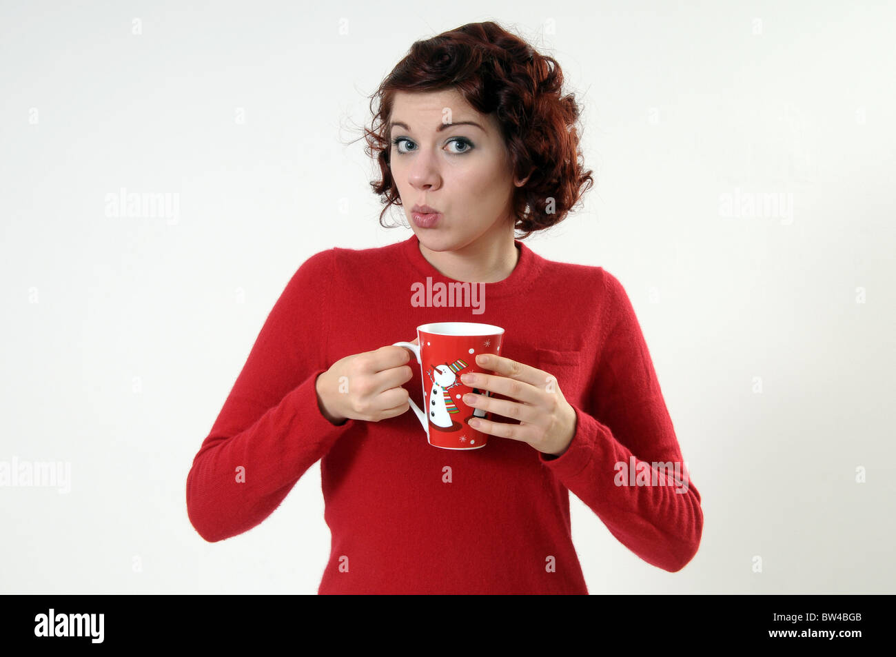 Woman holding a Christmas mug Stock Photo