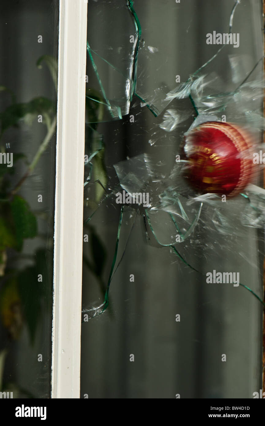 A cricket ball breaks a window Stock Photo Alamy