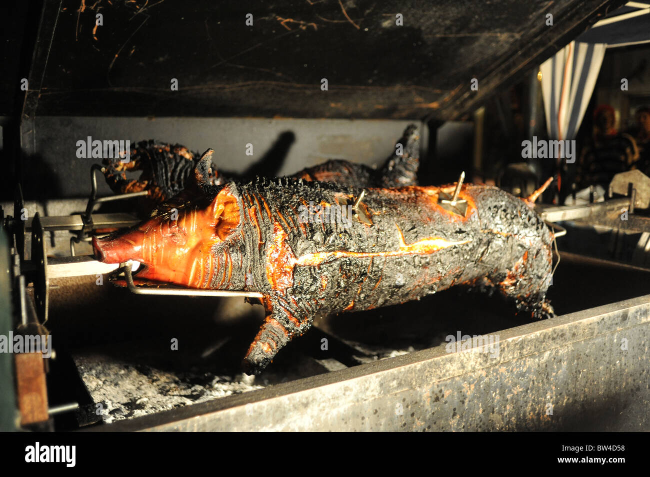 Hog roast on a spit Stock Photo
