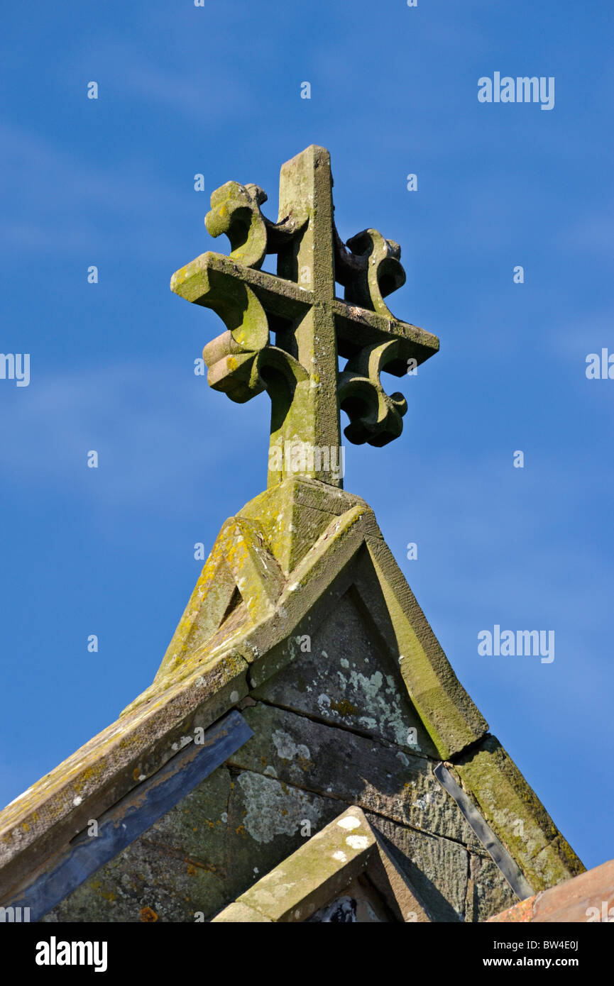 Ornate stone cross roof finial. Church of Saint Michael. Lamplugh, Cumbria, England, United Kingdom, Europe. Stock Photo