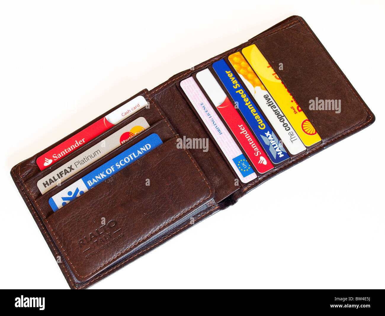 A man's wallet with a collection of bank and loyalty cards and a driving licence Stock Photo