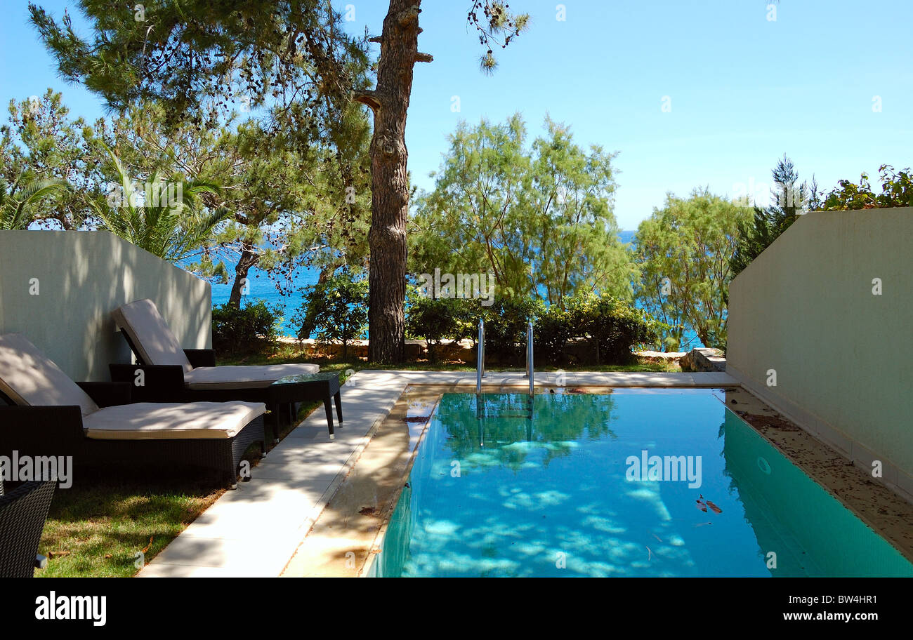 Swimming pool at apartment by luxury villa, Crete, Greece Stock Photo ... - Tropical Luxury Pool Apartments Greece
