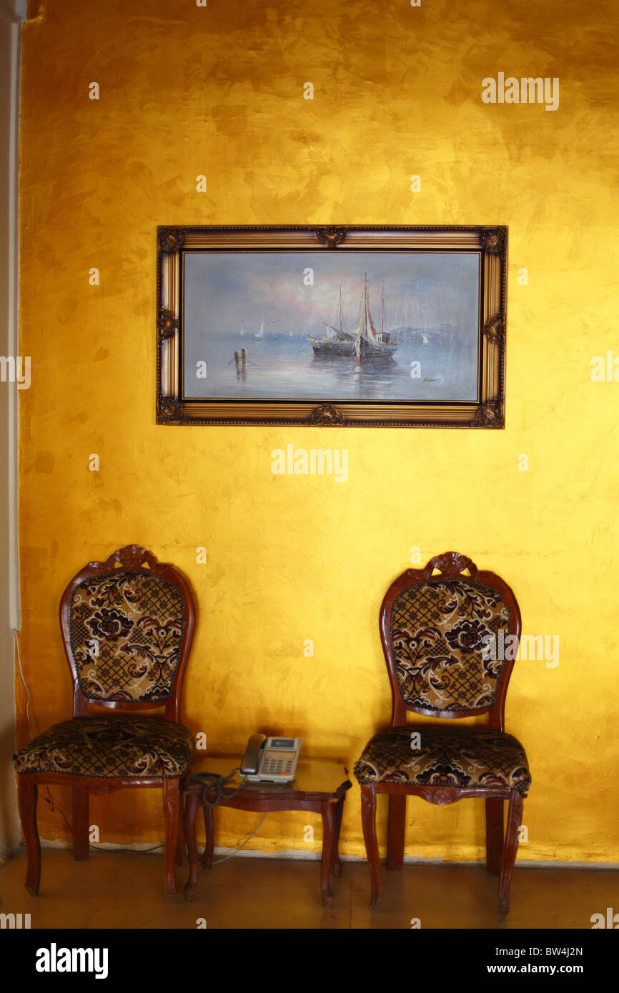 Amman, Jordan, downtown area, golden wall and chairs Stock Photo