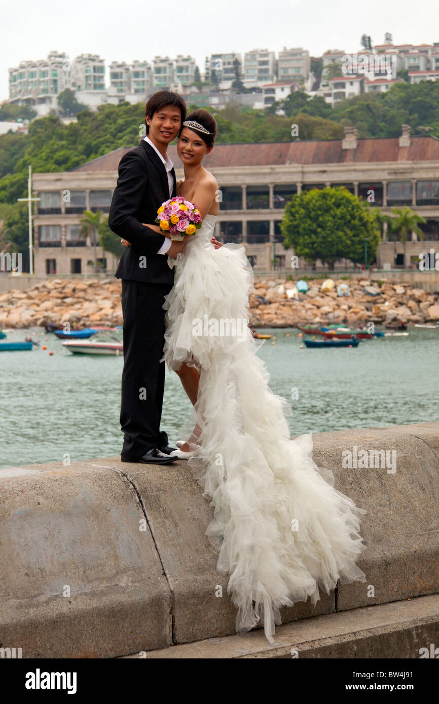 Young Chinese couple posing on their wedding day in Stanley, Hong Kong ...