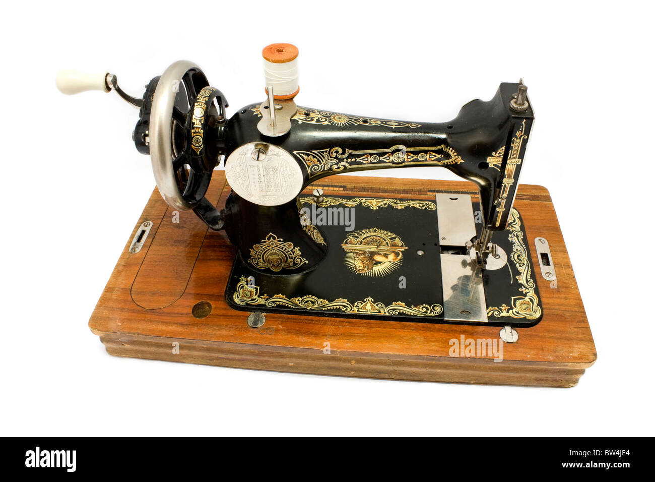 Antique sewing machine isolated on white background Stock Photo - Alamy