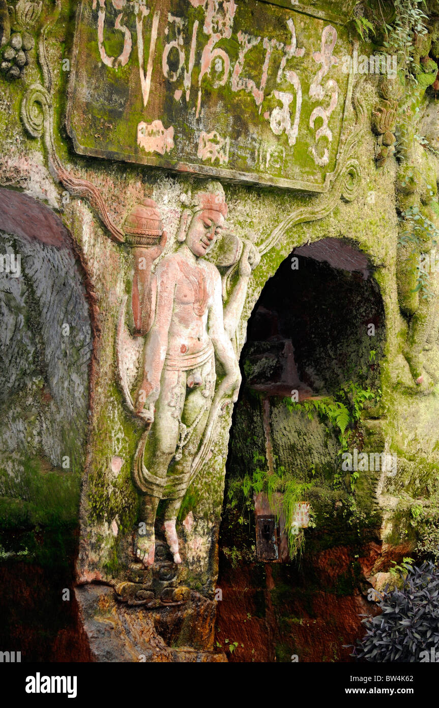 Stone carved bas-relief at entrance to Arhats cave at Dongfang Fodu Gongyuan (Oriental Buddha Park), Leshan, China Stock Photo