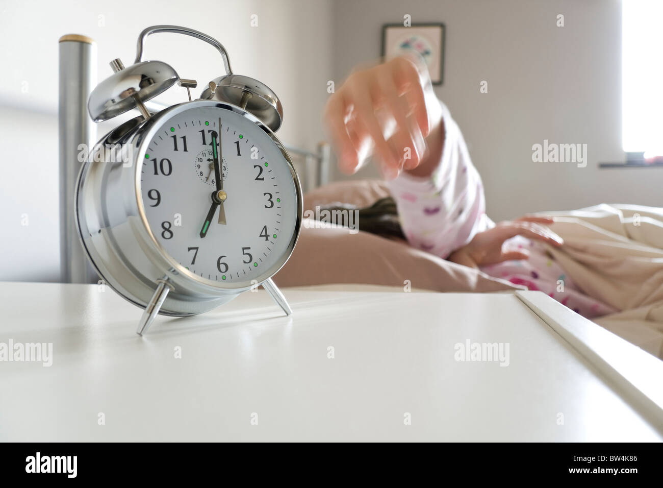 Turning off alarm clock Stock Photo