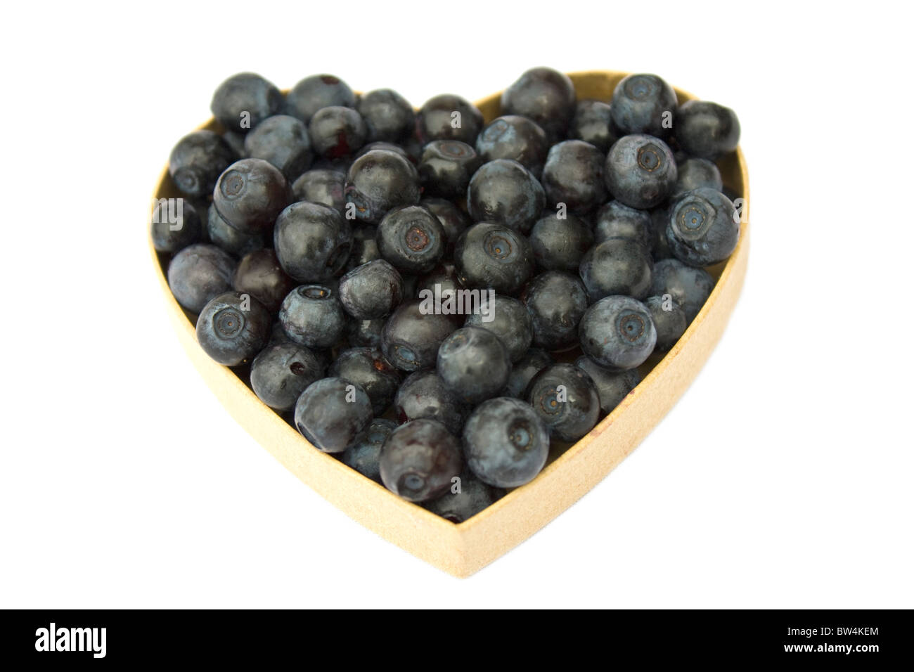 Bilberries (eruopean blueberries) in heart shaped box, isolated on white background Stock Photo