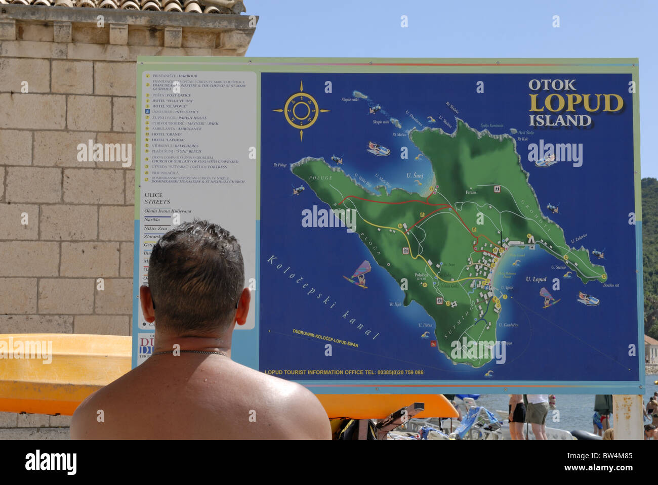 A visitor information board near the beach of the Lopud Village on the Lopud Island, Elafiti Islands. The Lopud Island is the... Stock Photo